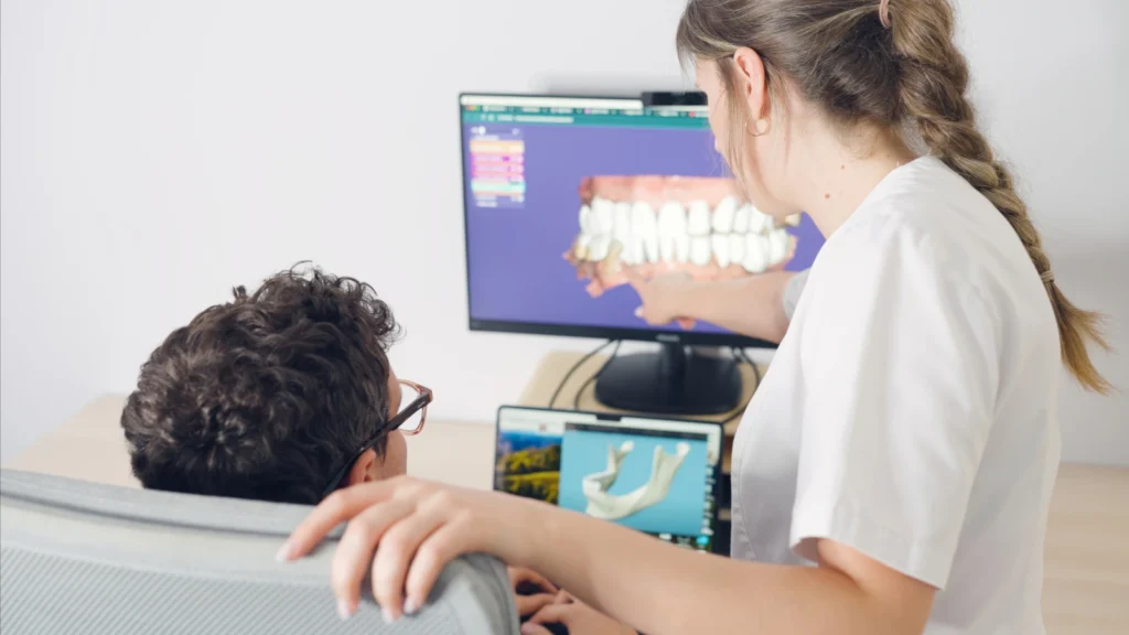 dentist showing 3d scan of patients teeth globe dental practice