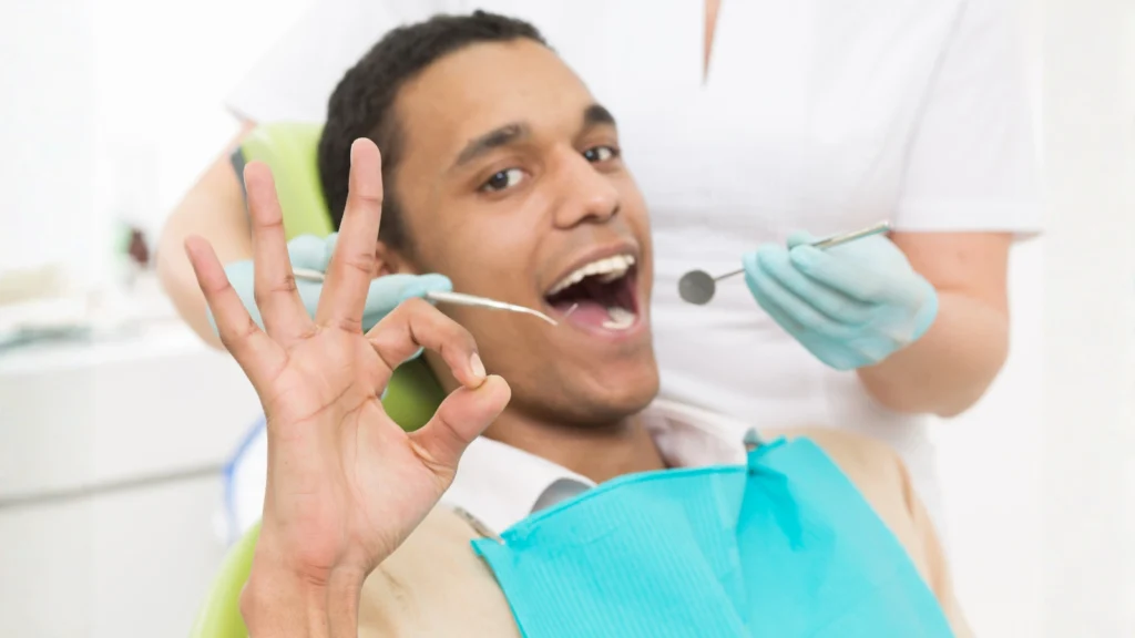 happy patient after hygiene appointment at globe dental practice